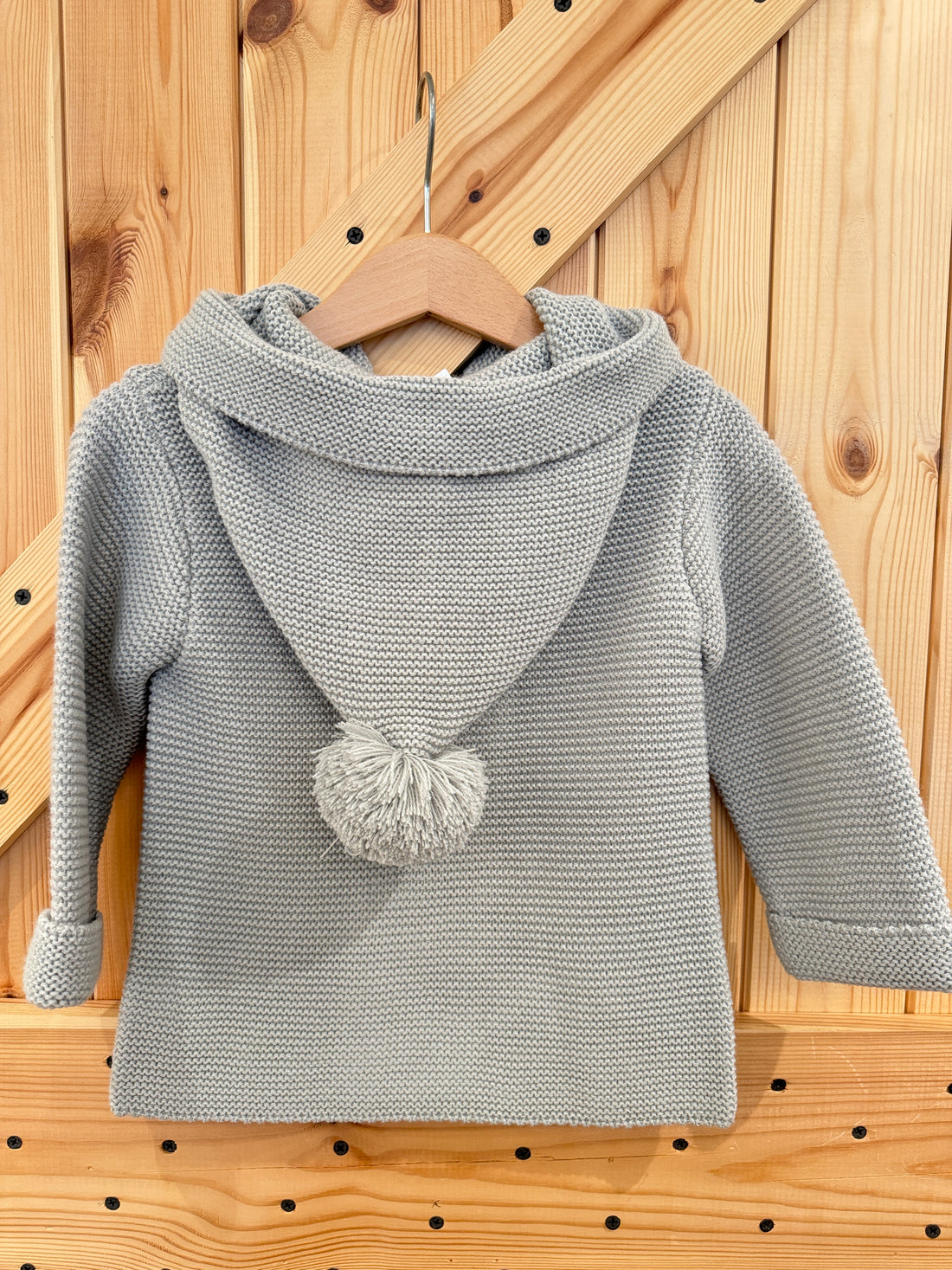 Chaqueta capucha pompón gris perla