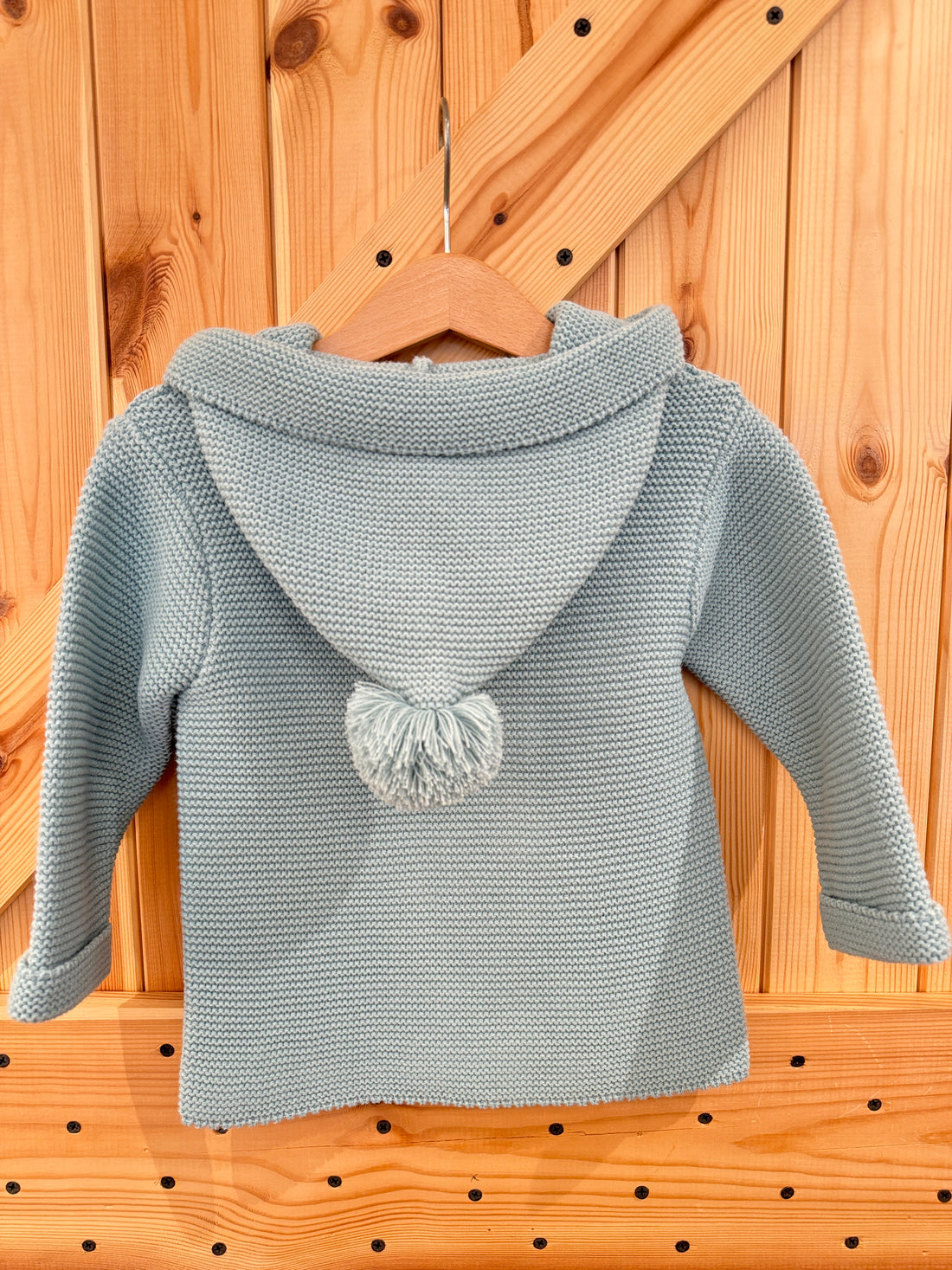 Chaqueta capucha pompón verde