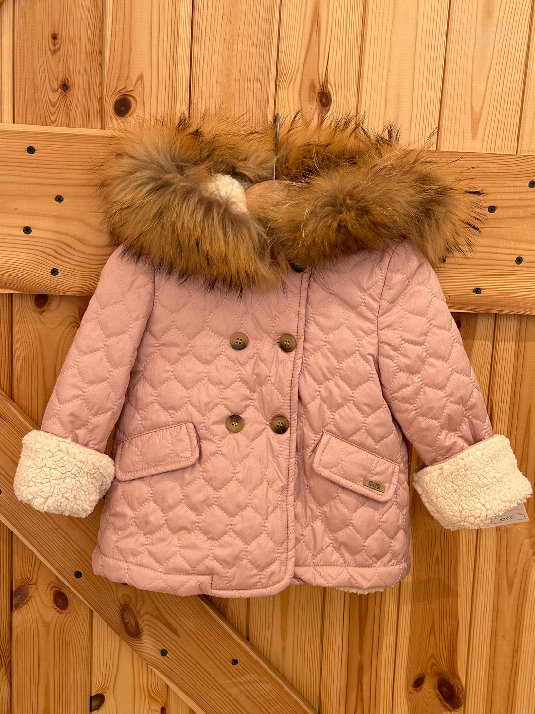 Abrigo tipo husk pelo natural rosa