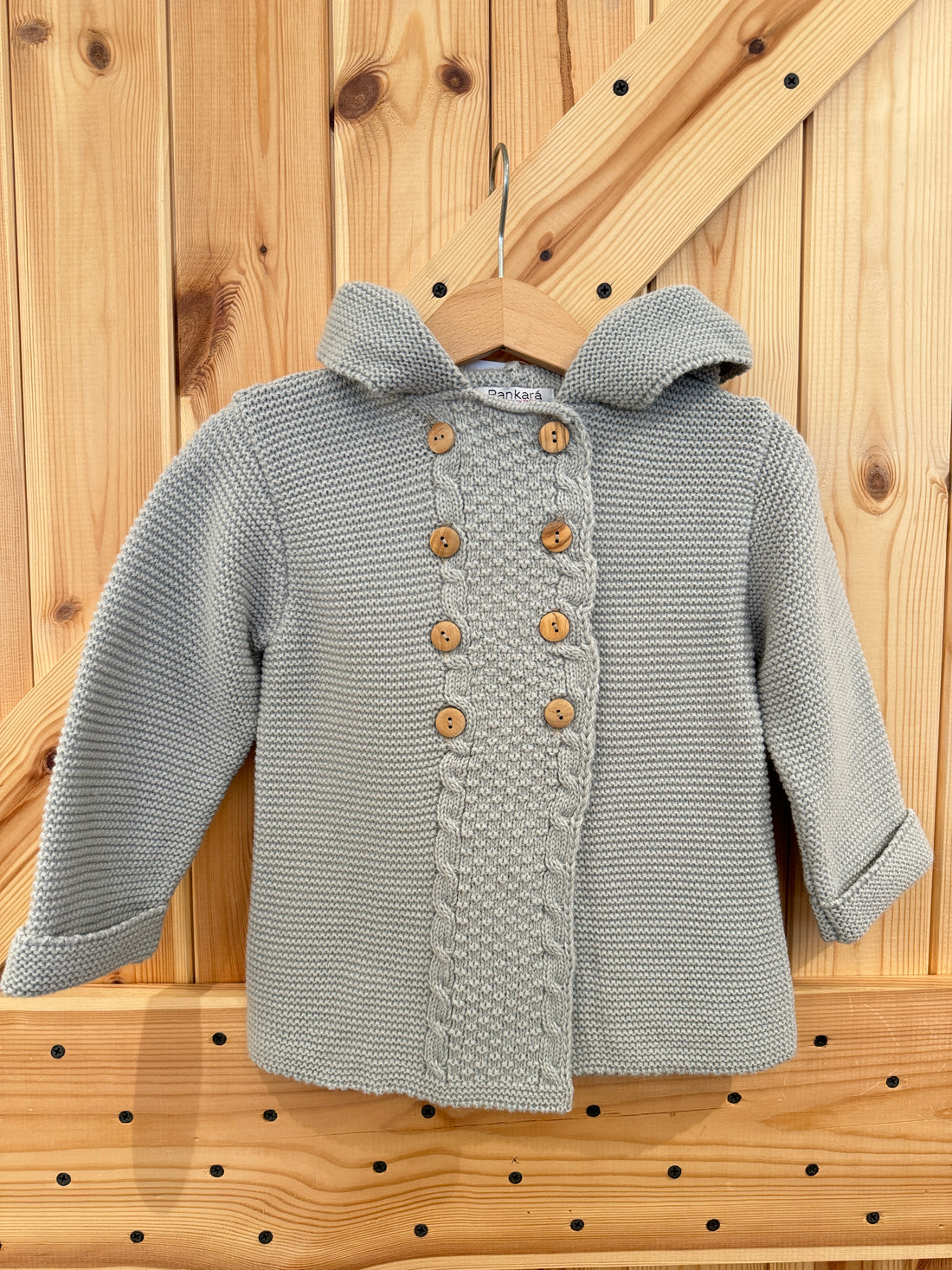 Chaqueta capucha pompón gris perla