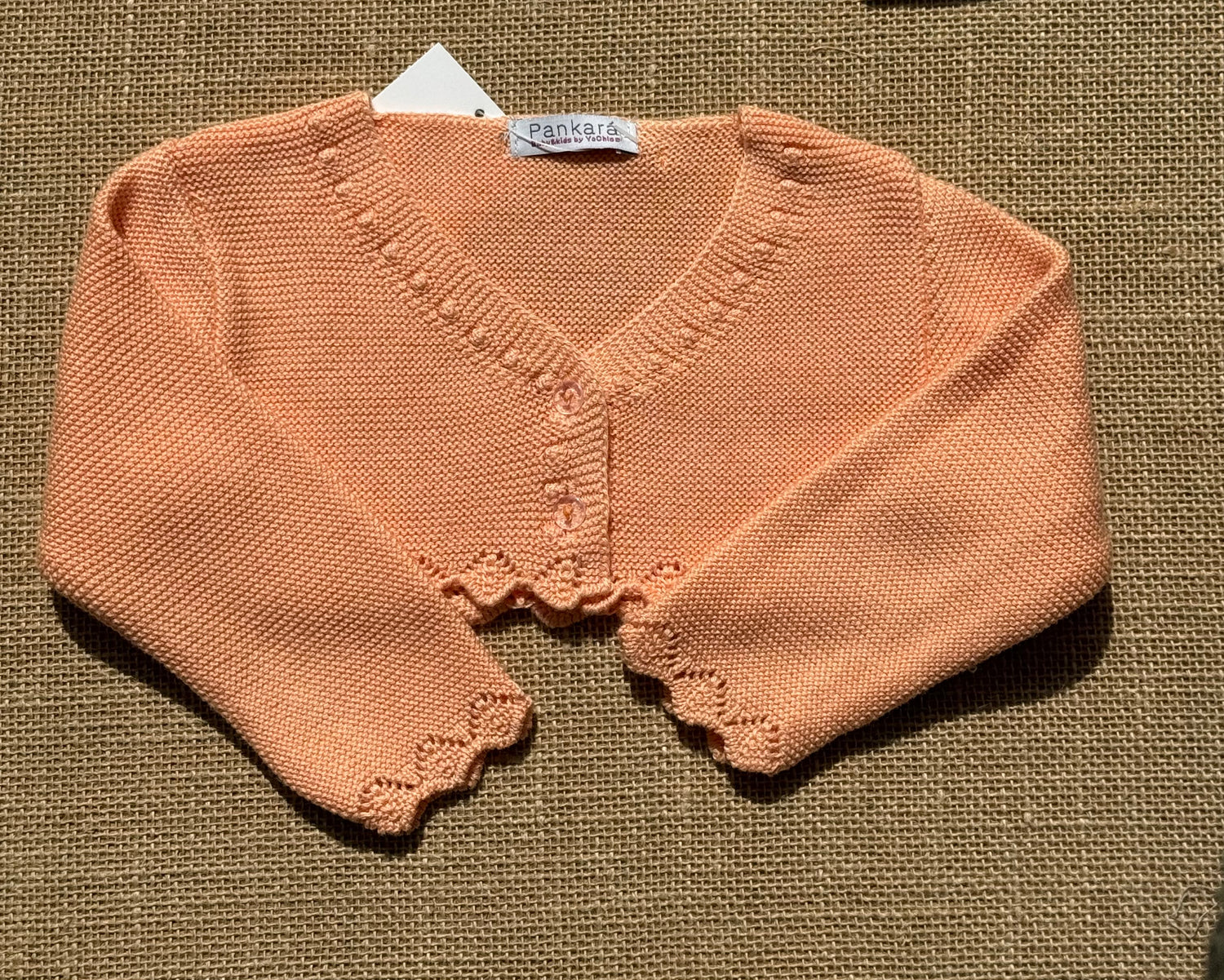 Chaqueta tipo bolero de punto