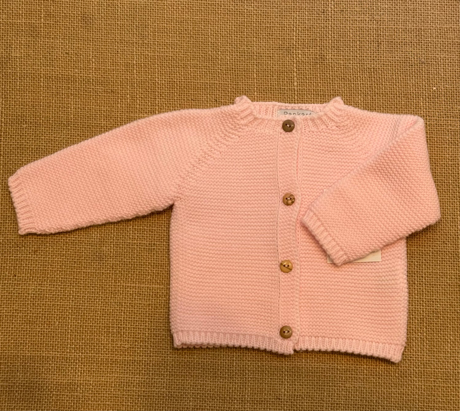 Chaqueta de punto rosa bebé